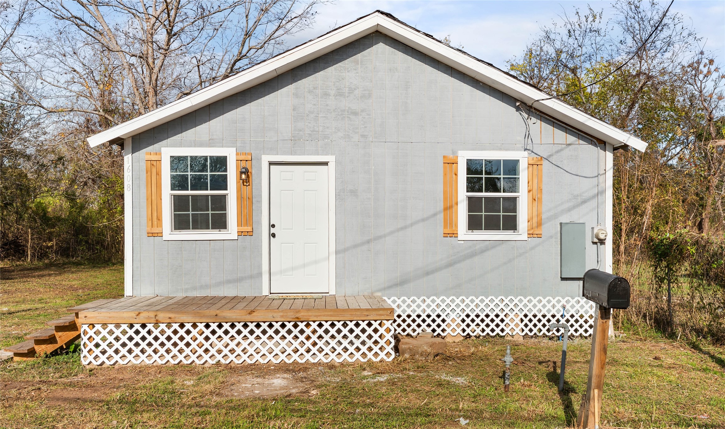 1608 Connie Street Wharton, TX 77488 - Photo 15 of 24 a front view of a house with a garden