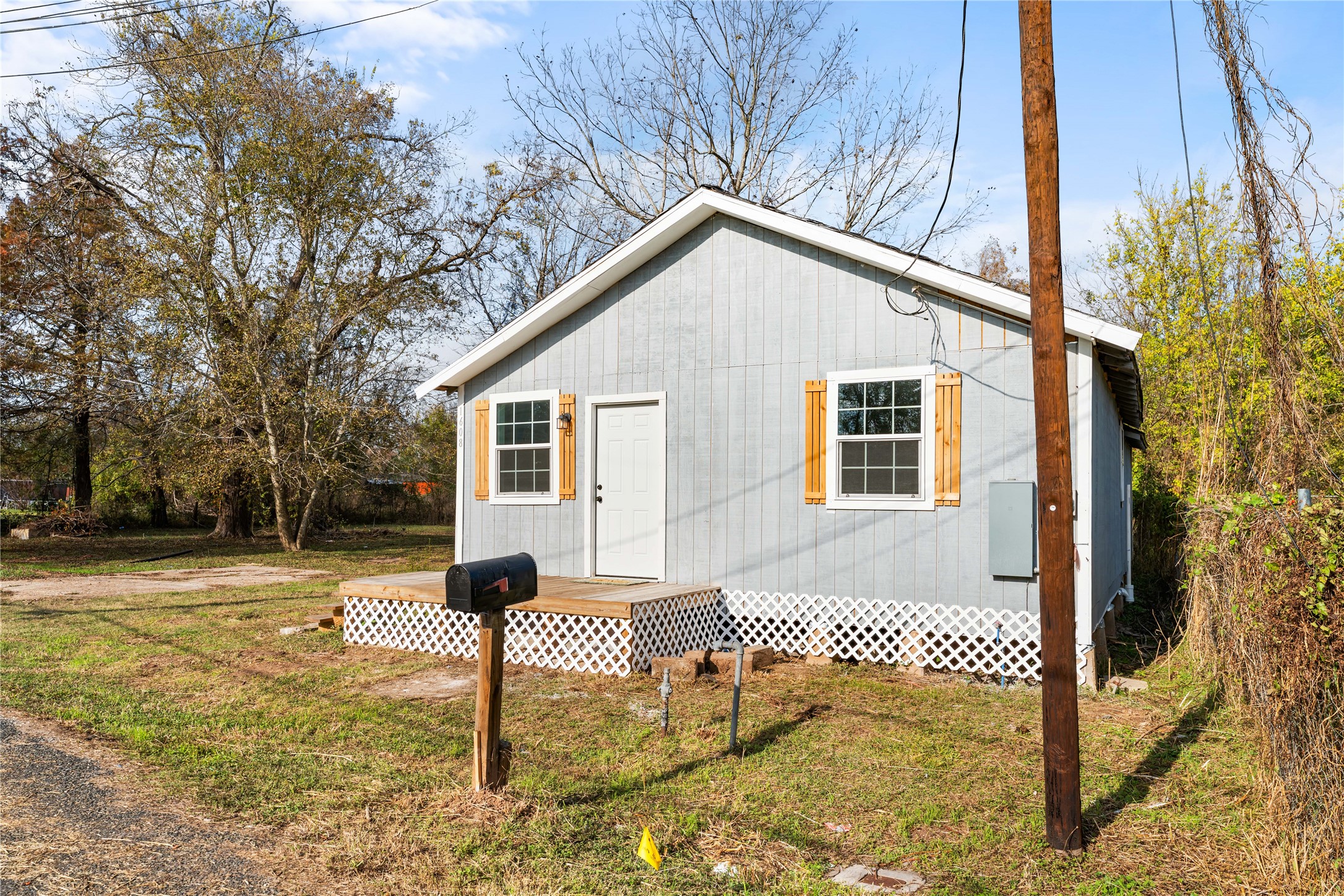 1608 Connie Street Wharton, TX 77488 - Photo 2 of 24 a front view of a house with a yard