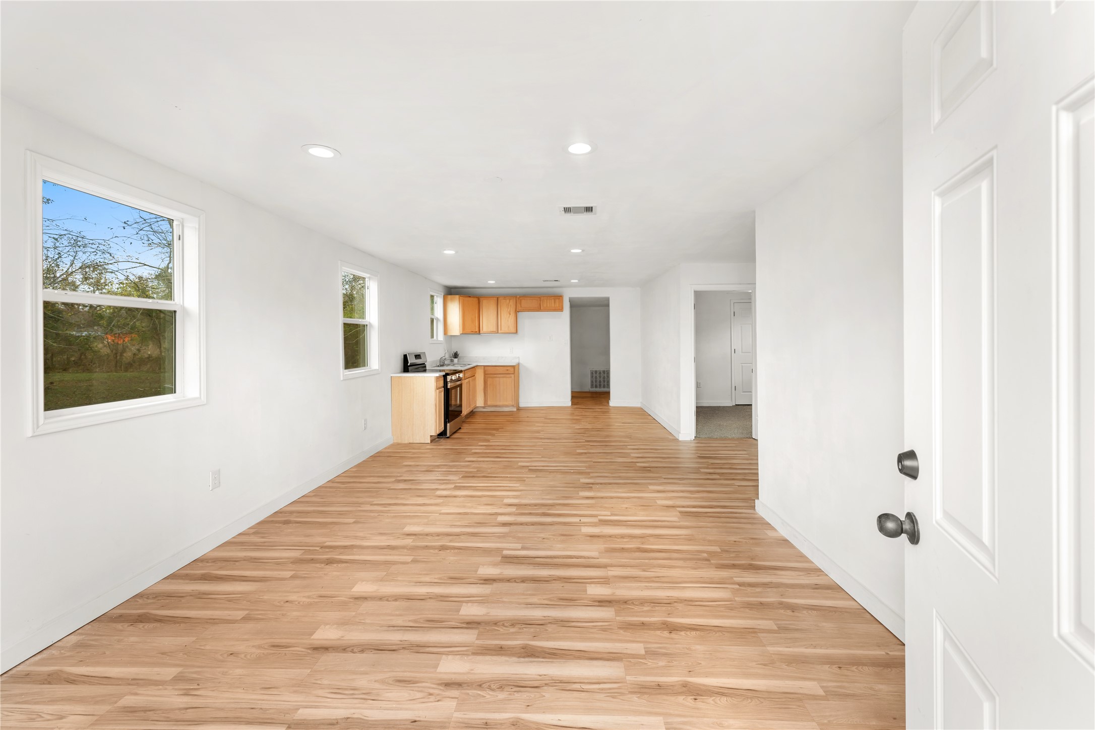 1608 Connie Street Wharton, TX 77488 - Photo 4 of 24 a big room with wooden floor and windows