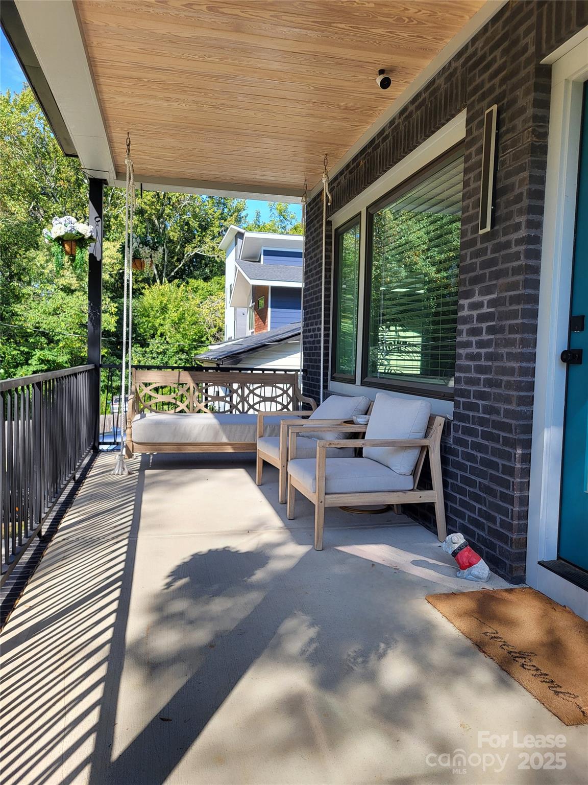 1932 St Mark Street Charlotte, NC 28216 - Photo 2 of 23 a balcony with furniture and a garden