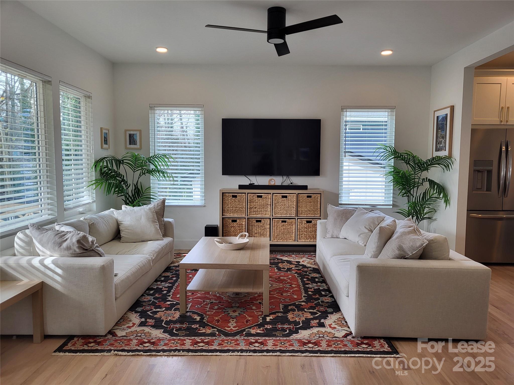 1932 St Mark Street Charlotte, NC 28216 - Photo 4 of 23 a living room with furniture and a flat screen tv