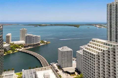 a view of roof deck with two chairs and wooden floor