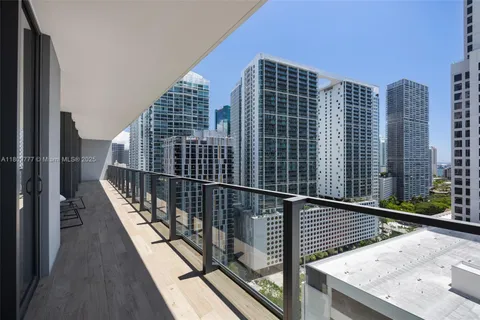 a view of balcony with wooden floor