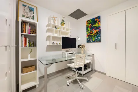 a workspace with furniture and bookshelf