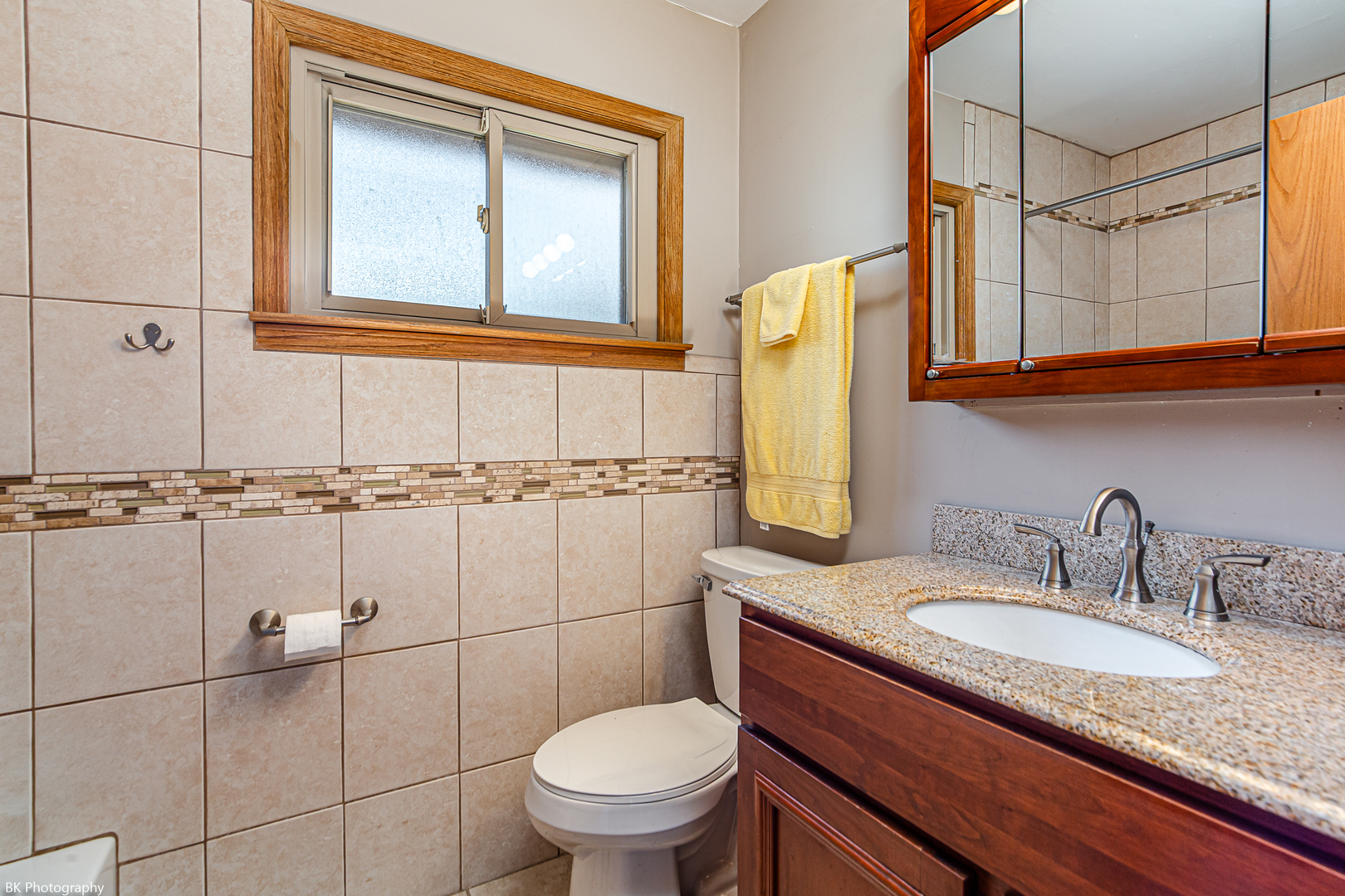 7049 West 91st Street Bridgeview, IL 60455 - Photo 12 of 25 a bathroom with a granite countertop toilet sink and mirror