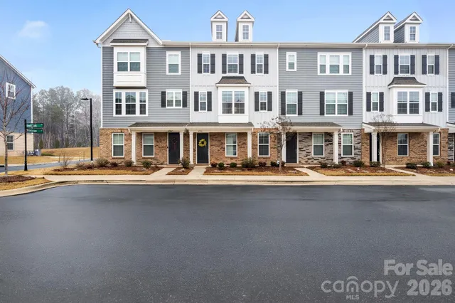a front view of a building with swimming pool