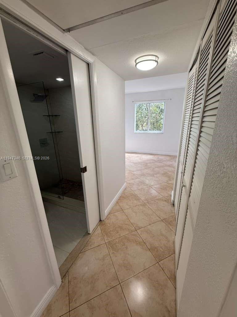 15221 Southwest 80th Street, Unit 313 Miami, FL 33193 - Photo 14 of 19 a view of entryway with stairs and a window
