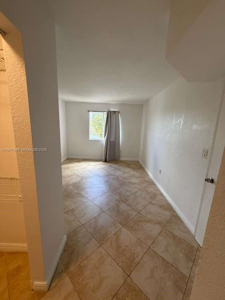 15221 Southwest 80th Street, Unit 313 Miami, FL 33193 - Photo 17 of 19 a view of a livingroom with a window