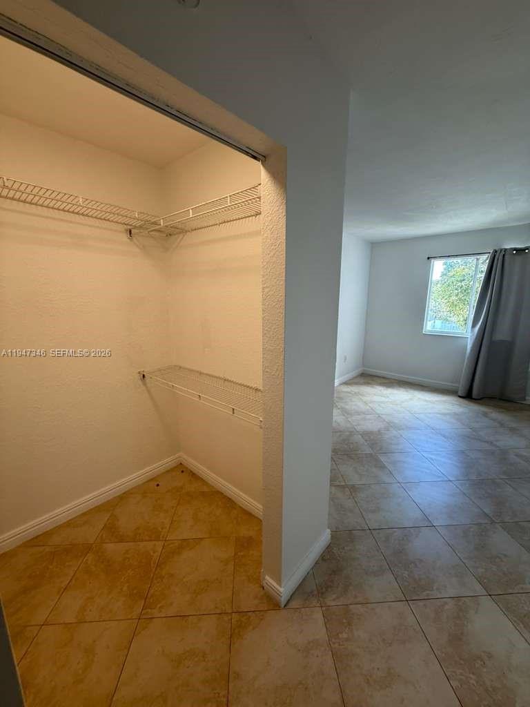15221 Southwest 80th Street, Unit 313 Miami, FL 33193 - Photo 19 of 19 a view of an empty room and window