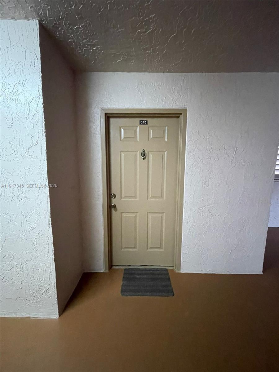 15221 Southwest 80th Street, Unit 313 Miami, FL 33193 - Photo 4 of 14 a view of an empty room