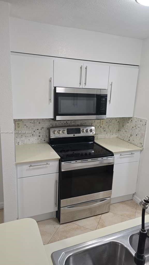15221 Southwest 80th Street, Unit 313 Miami, FL 33193 - Photo 8 of 19 a utility room with washer and dryer