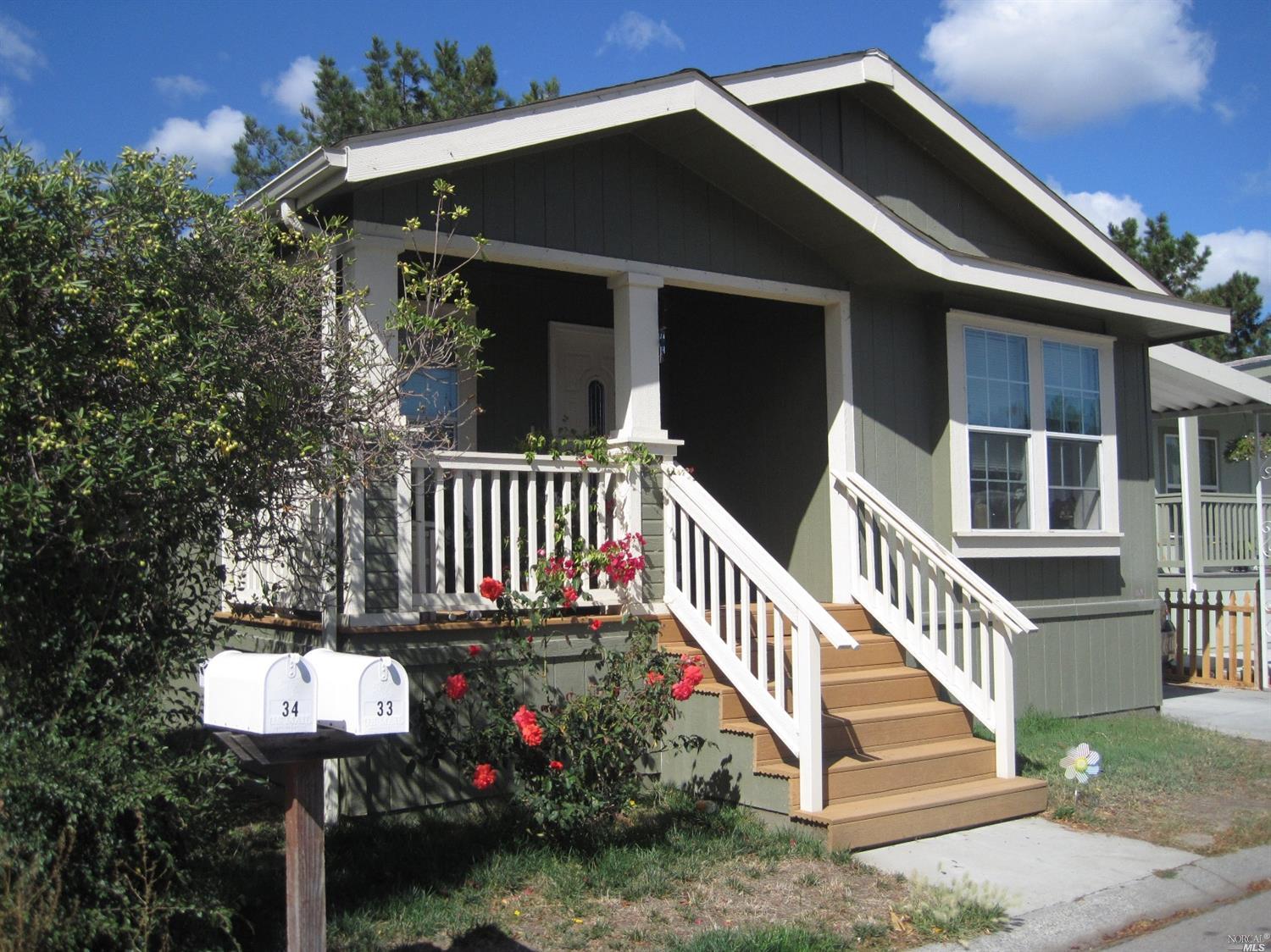33 Yosemite Road, Unit 299 San Rafael, CA 94903 - Photo 1 of 1 a view of a house with wooden deck and furniture