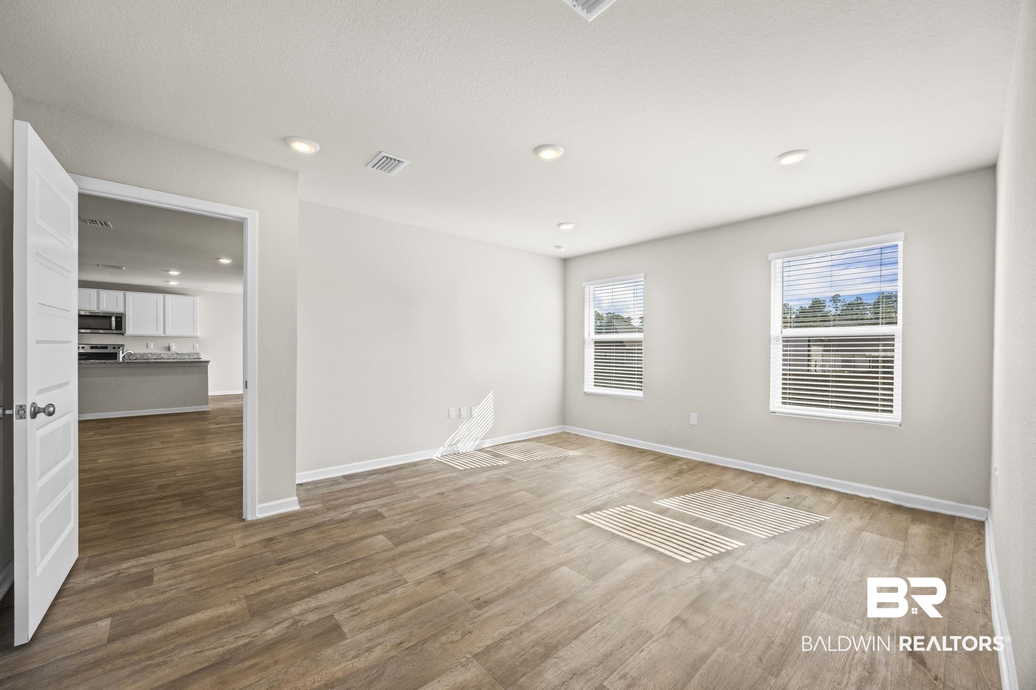 3090 Camino Real Loop Lillian, AL 36549 - Photo 25 of 29 Spare room featuring dark wood-type flooring and recessed lighting