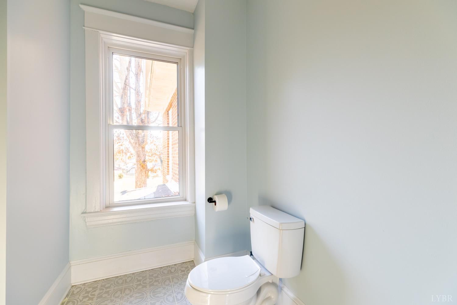 211 Cook Avenue Brookneal, VA 24528 - Photo 29 of 50 a white toilet sitting next to a window in a bathroom