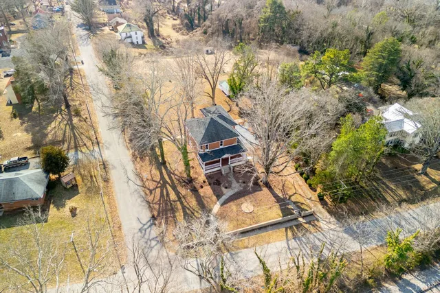 a backyard of a house with large trees