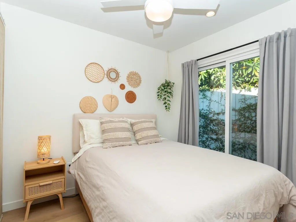 4751 Altadena Avenue San Diego, CA 92115 - Photo 43 of 47 a bedroom with a bed and a window