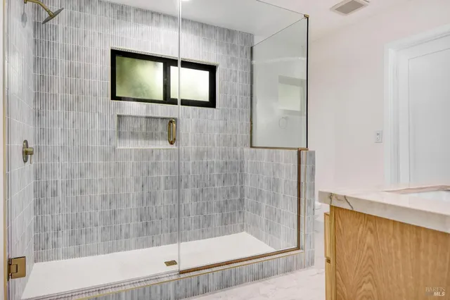 a view of an empty room with fire place and a fireplace