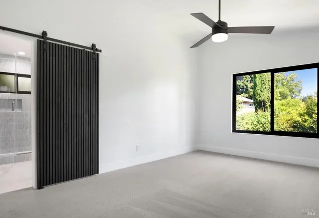 a bathroom with a sink toilet vanity and shower