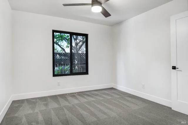 a living room with furniture a rug and a fireplace