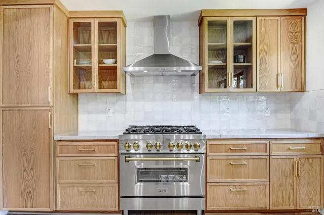 a bathroom with a granite countertop sink mirror and double