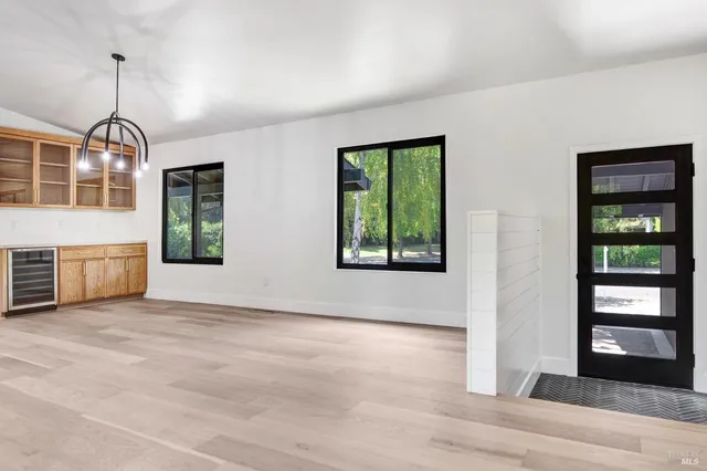 a bathroom with a granite countertop sink a toilet and shower
