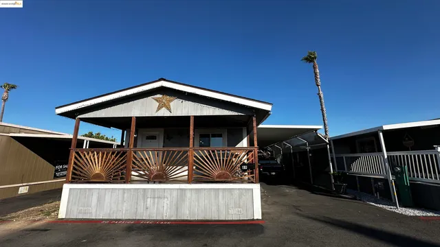 a front view of a house with parking space