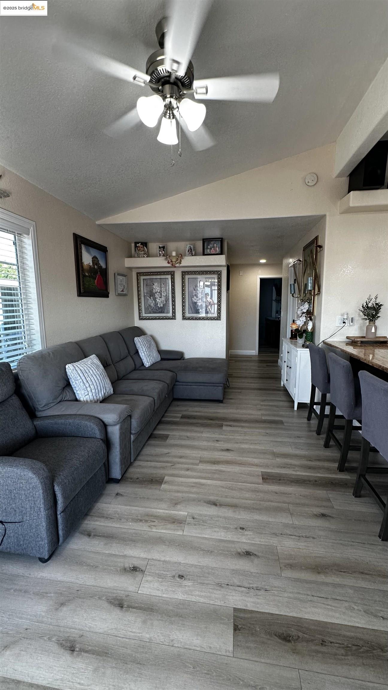 3301 Buchanan Road, Unit 89 Antioch, CA 94509 - Photo 20 of 22 a living room with furniture and a chandelier