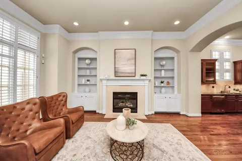a living room with furniture or fireplace and a wooden floor