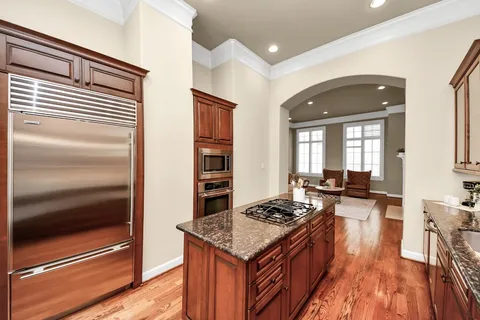 a kitchen with a stove and a refrigerator