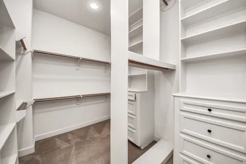 a view of an empty walk in closet