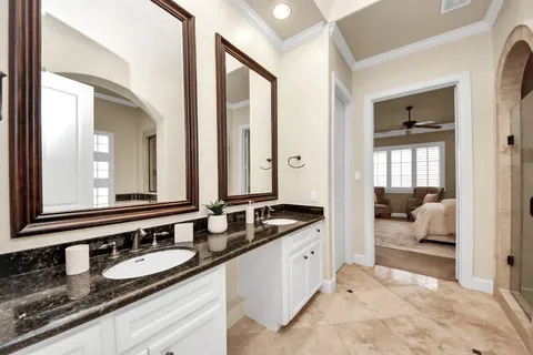 a en suite bathroom with sink and mirror