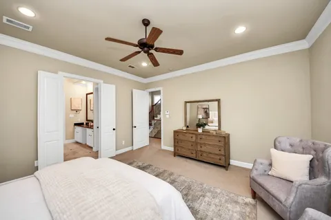 a spacious bedroom with a bed and furniture