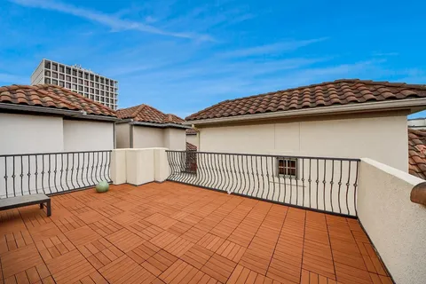 a view of terrace with wooden floor and fence