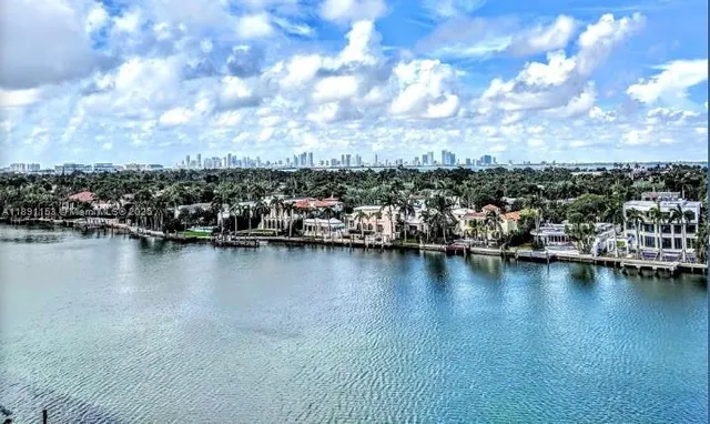 an aerial view of residential building with ocean view