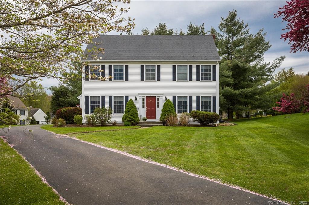 6 Howes Court Ridgefield, CT 06877 - Photo 1 of 1 front view of a house with a yard