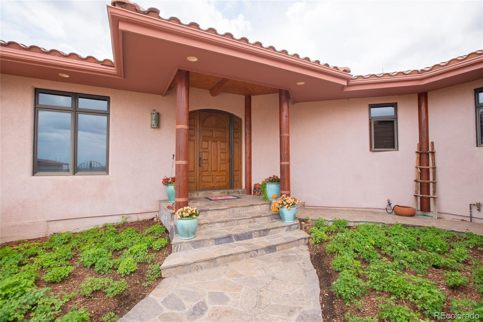 11503 East Smith Road Elbert, CO 80106 - Photo 13 of 44 a front view of a house with a yard