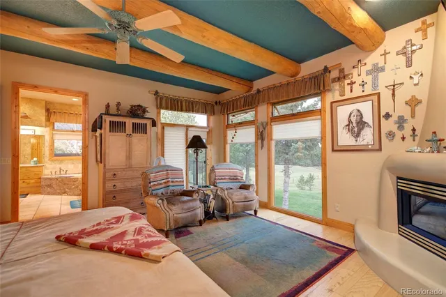 a bedroom with furniture and a fireplace