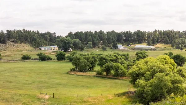 a view of a lake with a yard
