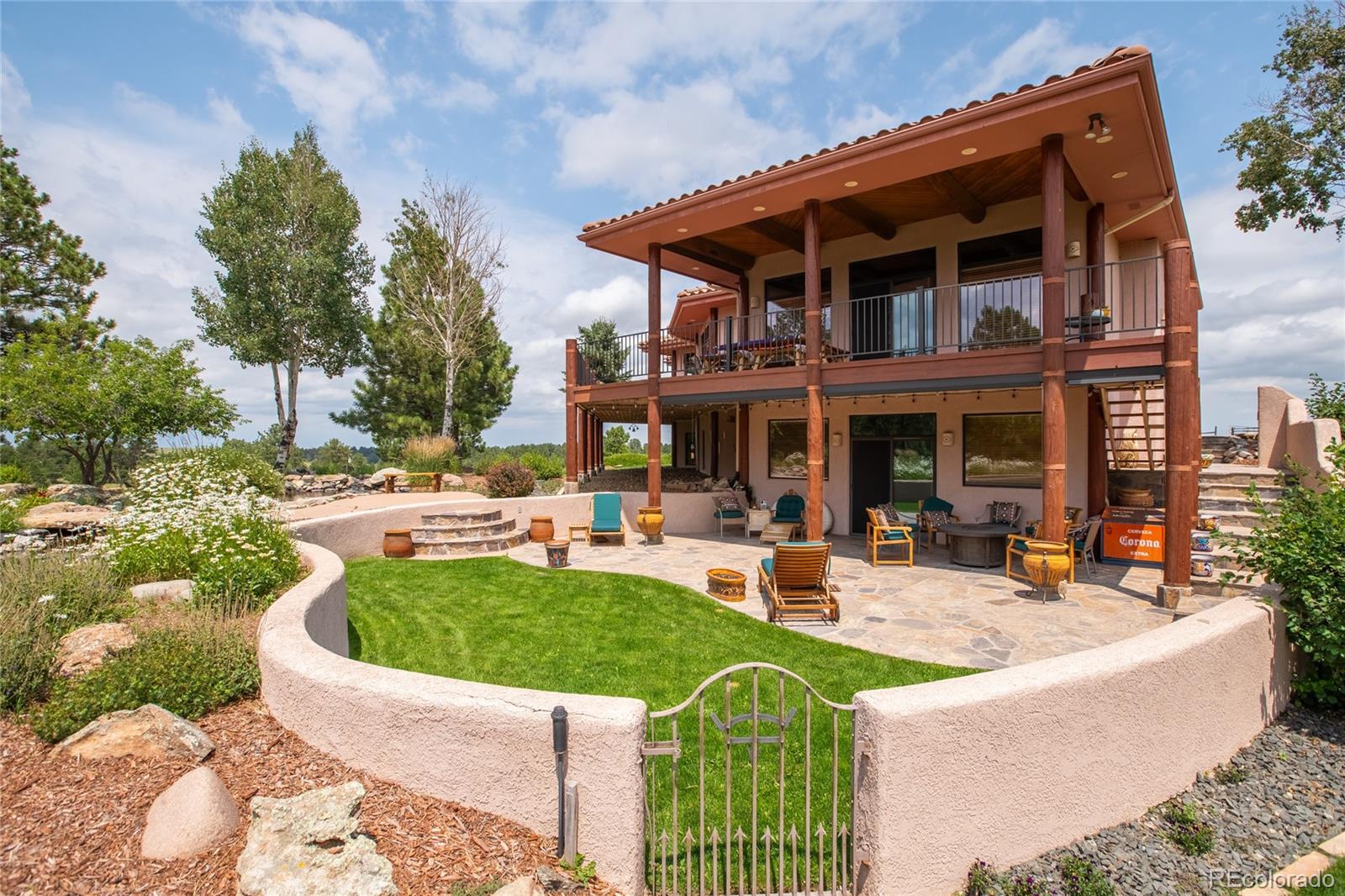 11503 East Smith Road Elbert, CO 80106 - Photo 35 of 44 a view of a house with swimming pool and sitting area
