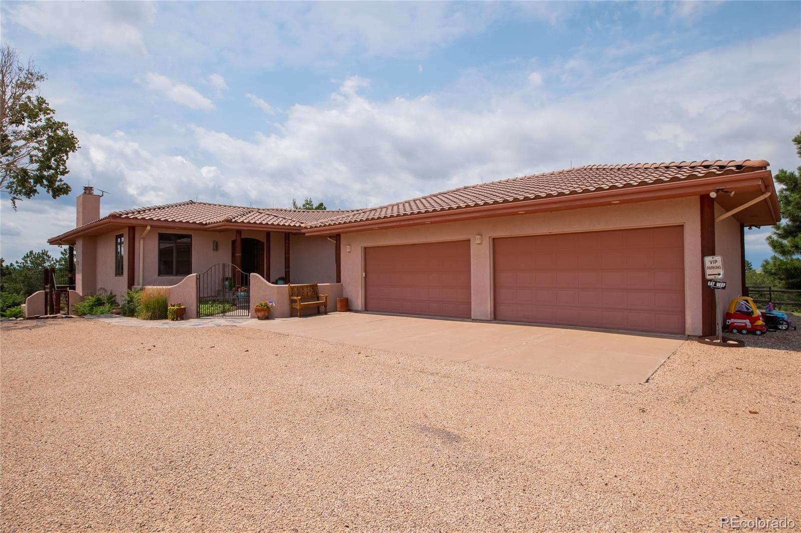 11503 East Smith Road Elbert, CO 80106 - Photo 41 of 44 a front view of house with yard and trees around
