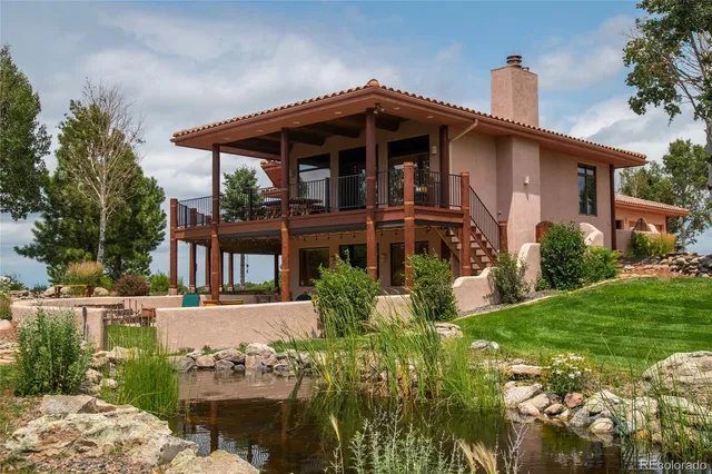 a view of a chairs and table in the patio