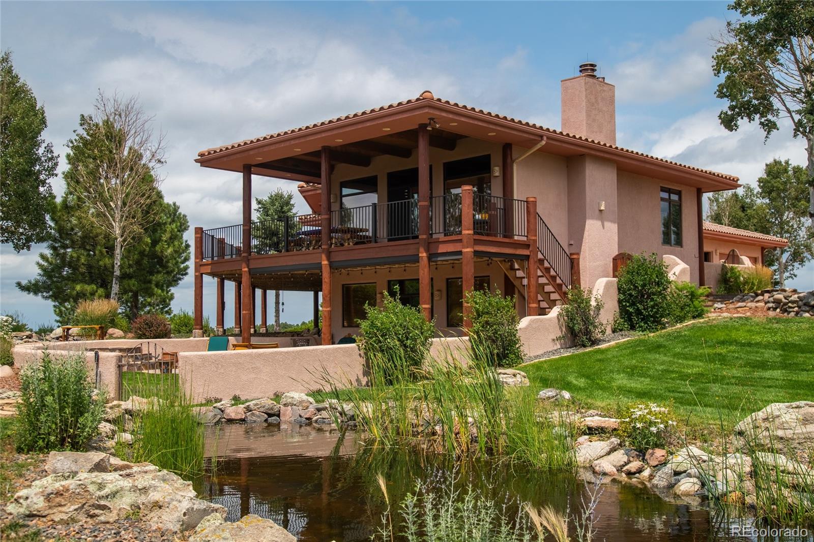 11503 East Smith Road Elbert, CO 80106 - Photo 43 of 44 a front view of a house with garden