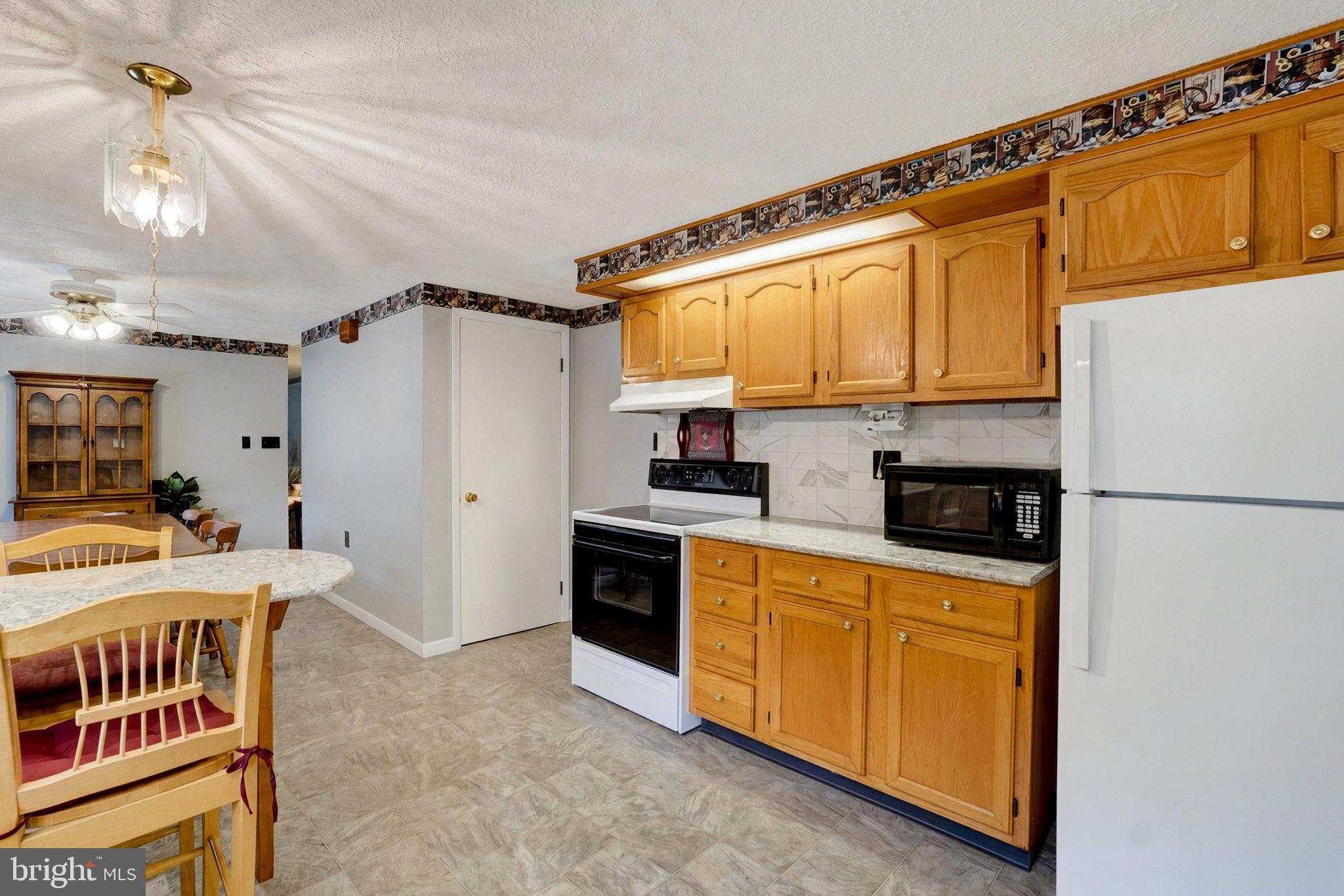 13079 Center Road Stewartstown, PA 17363 - Photo 8 of 27 Granite counters & tile backsplash