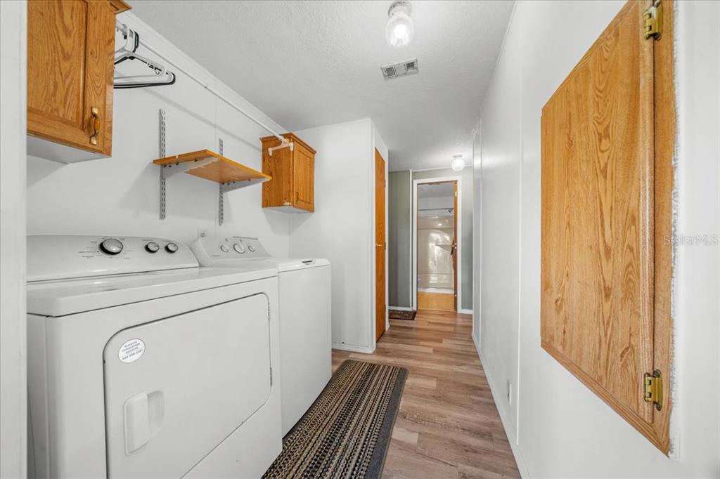 10865 Southeast Timucuan Road Summerfield, FL 34491 - Photo 30 of 35 a utility room with dryer and washer