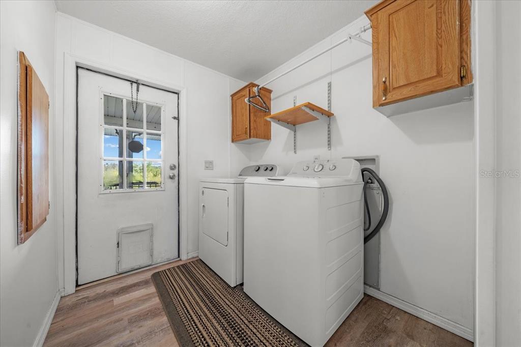 10865 Southeast Timucuan Road Summerfield, FL 34491 - Photo 31 of 35 a utility room with dryer and washer