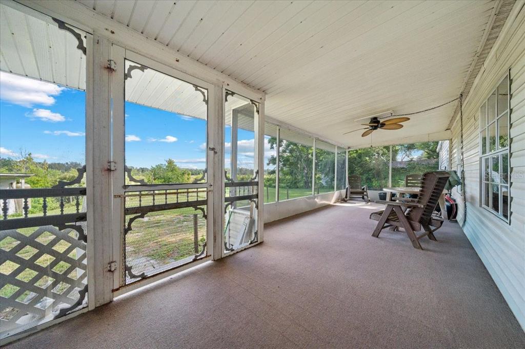 10865 Southeast Timucuan Road Summerfield, FL 34491 - Photo 34 of 35 a view of a porch with porch