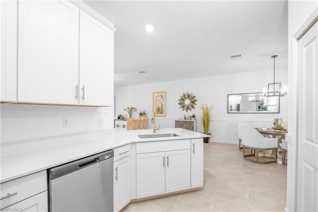 14656 Ballast Way Alva, FL 33920 - Photo 12 of 30 a kitchen with a sink and cabinets