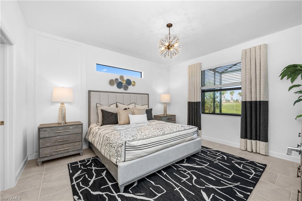 14656 Ballast Way Alva, FL 33920 - Photo 19 of 30 a bedroom with a large bed and a window