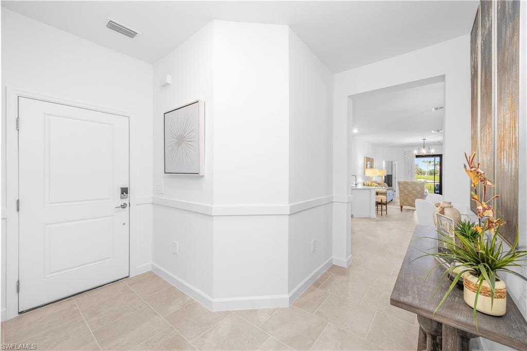 14656 Ballast Way Alva, FL 33920 - Photo 24 of 30 a view of a hallway to a livingroom and furniture