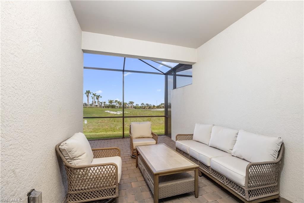 14656 Ballast Way Alva, FL 33920 - Photo 30 of 30 a living room with furniture and a floor to ceiling window